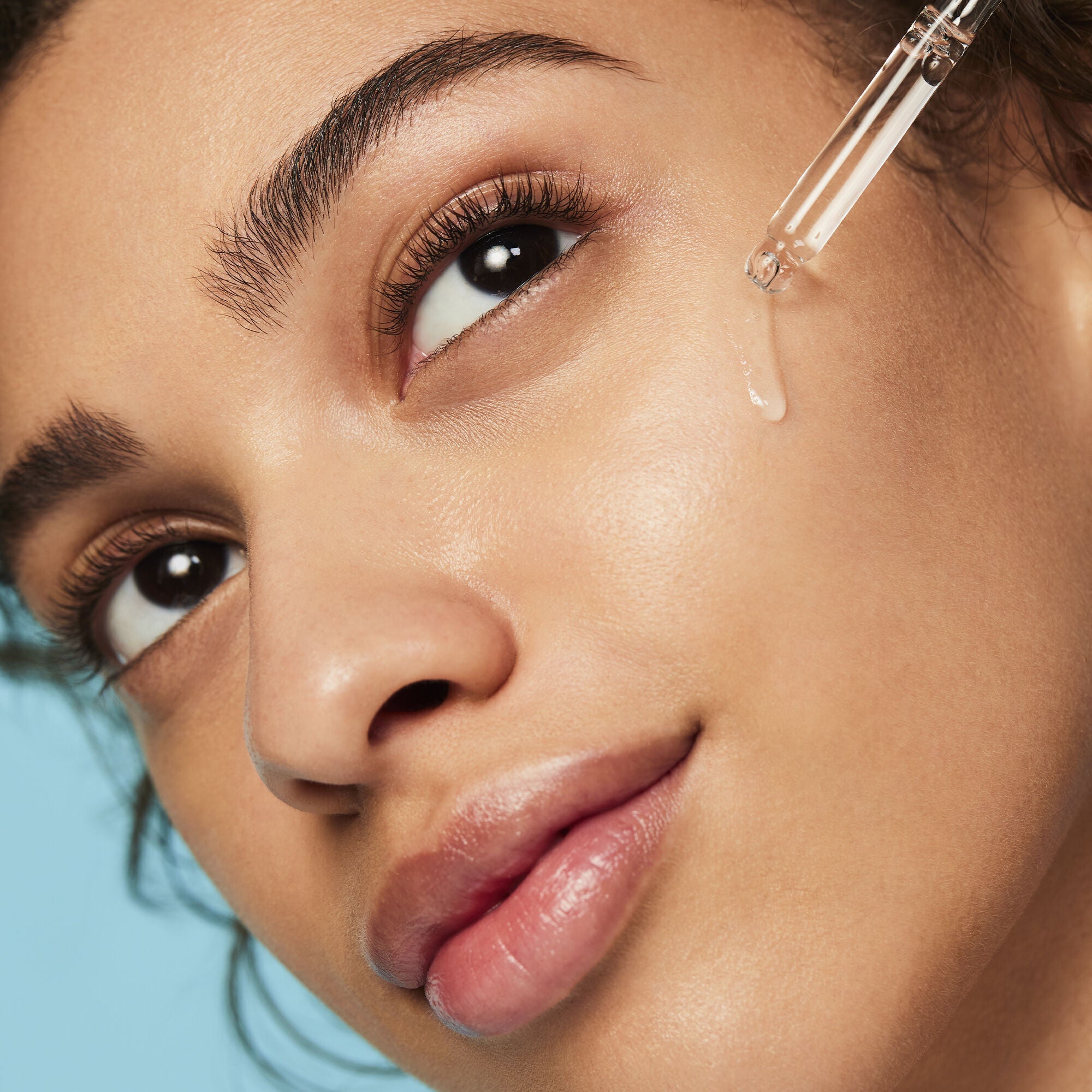 Applying Triple Bounce Face Hyaluronic Serum