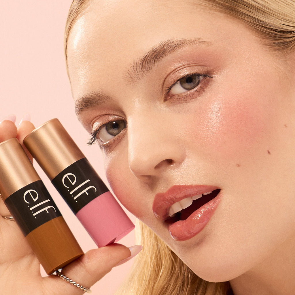 Woman holding two Soft Glam Cream Blush Shades
