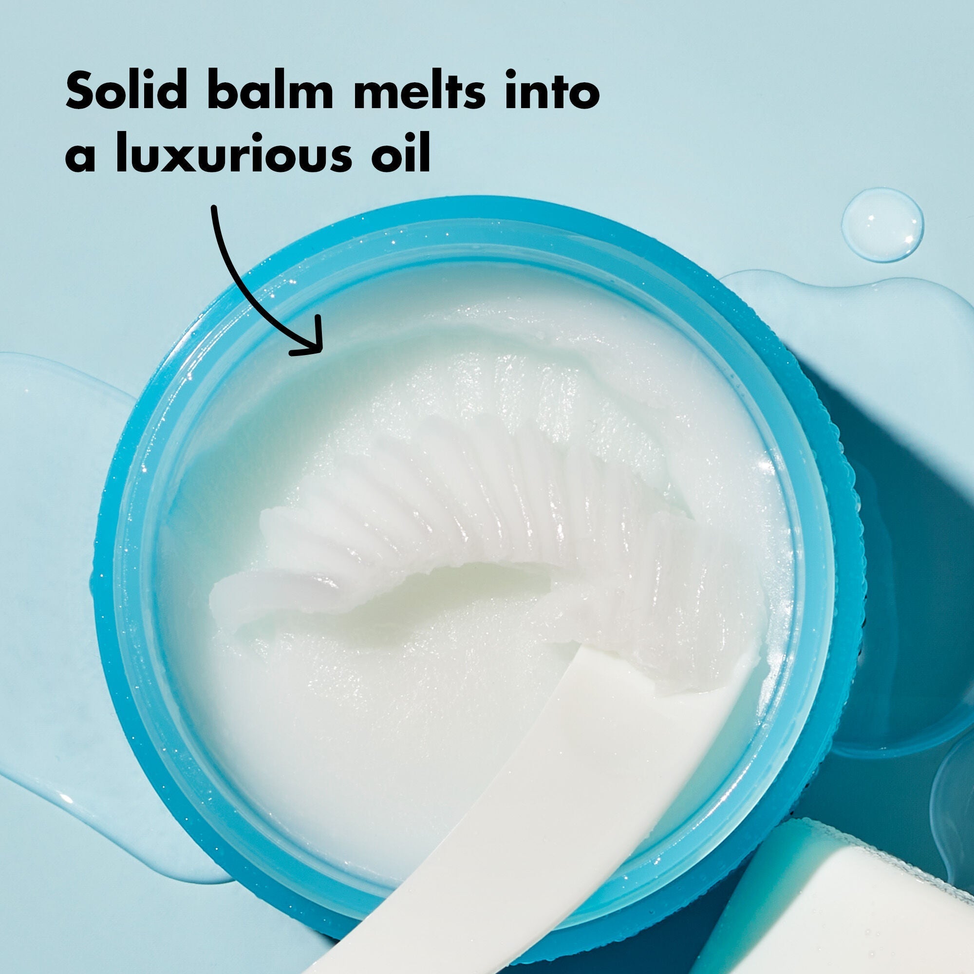 Solid balm melting into luxurious oil