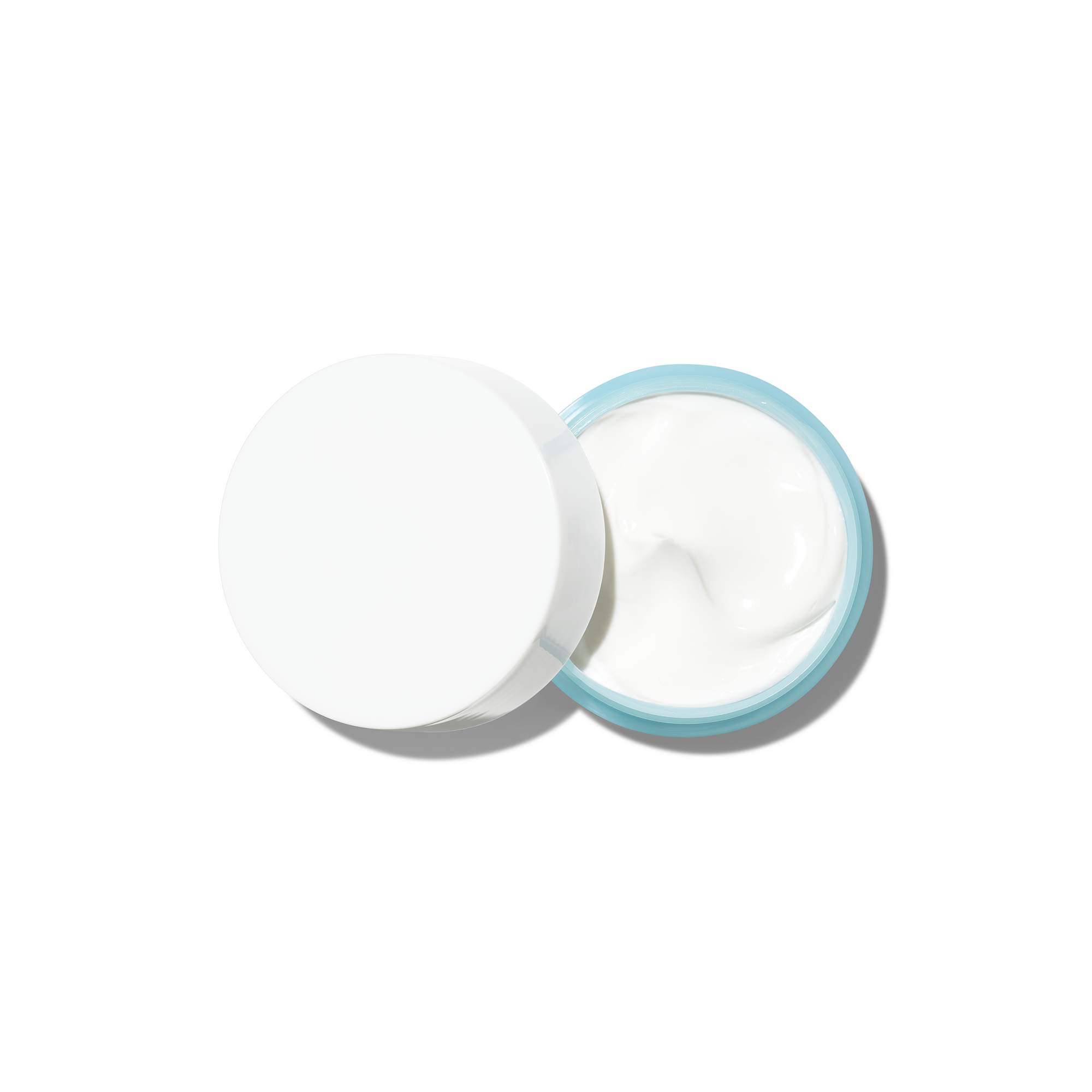 Open jar of face cream with a white lid