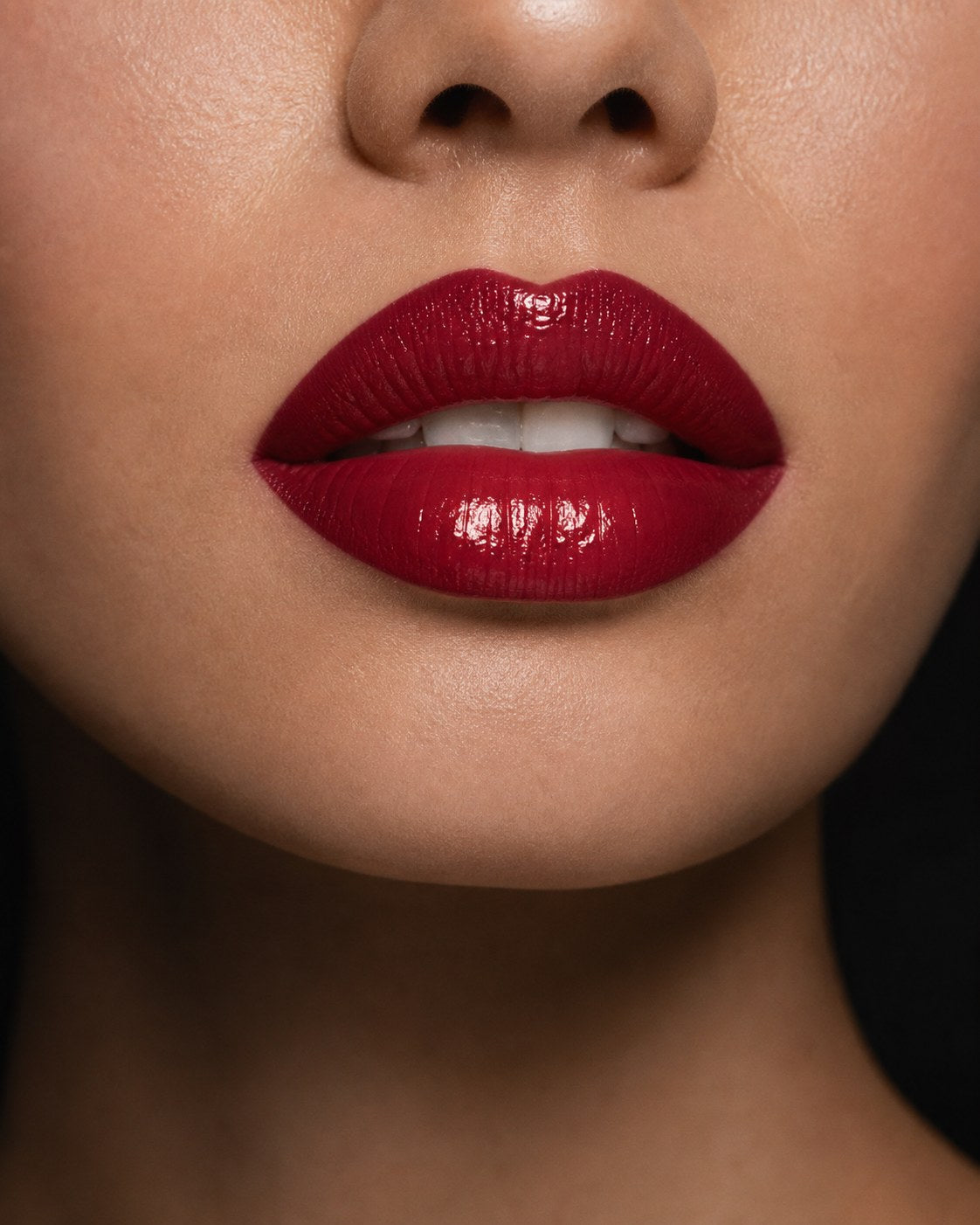 Close-up glossy berry lip makeup